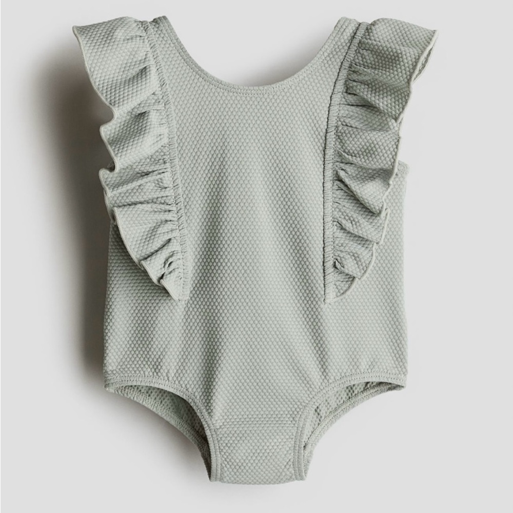 Light Sage Green Flounced Swimsuit
NWT size 9-12 months